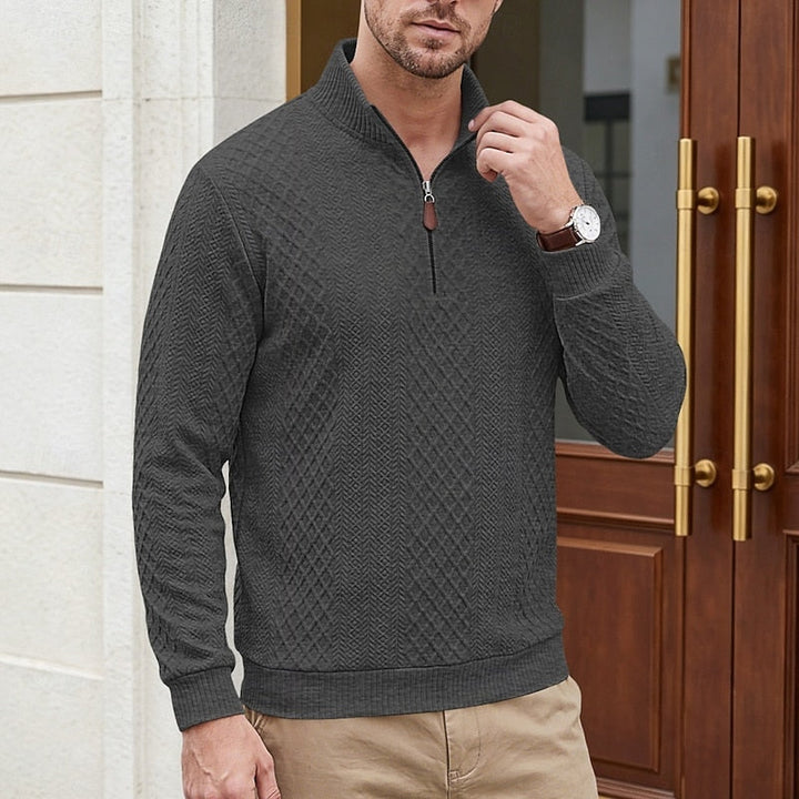 Man wearing Bennett dark gray textured quarter-zip pullover, close-up front view