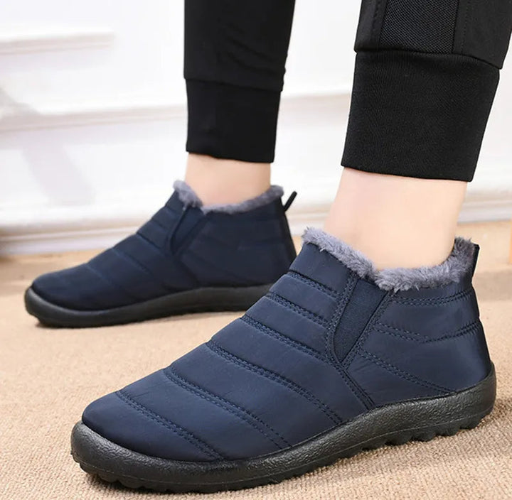Callum navy ankle snow boots worn on model, standing pose