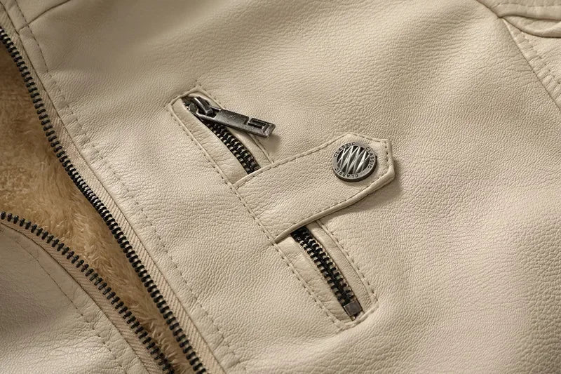 Close-up of chest zip pocket and snap button detail on Grayson leather jacket