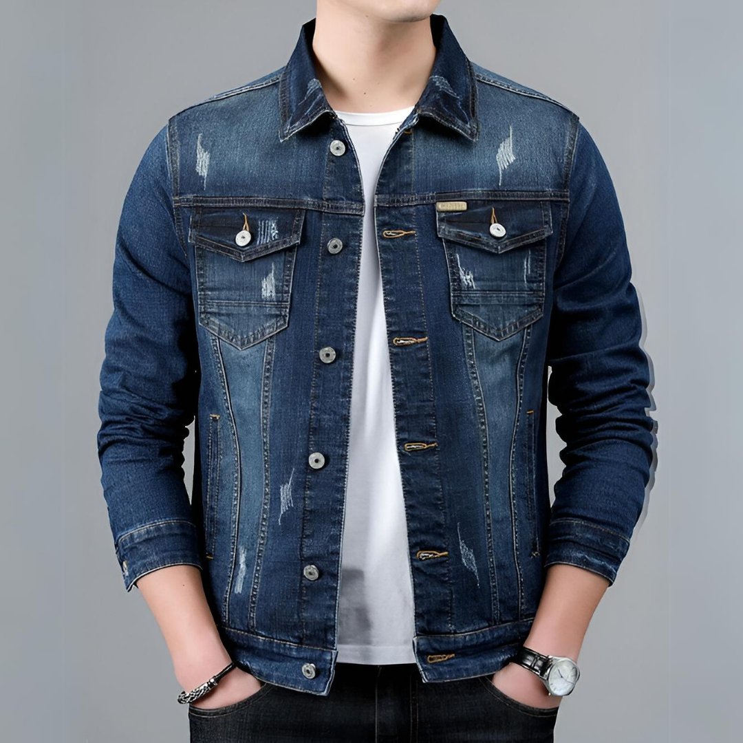 Jasper dark wash denim jacket worn buttoned, front view with hands in pockets
