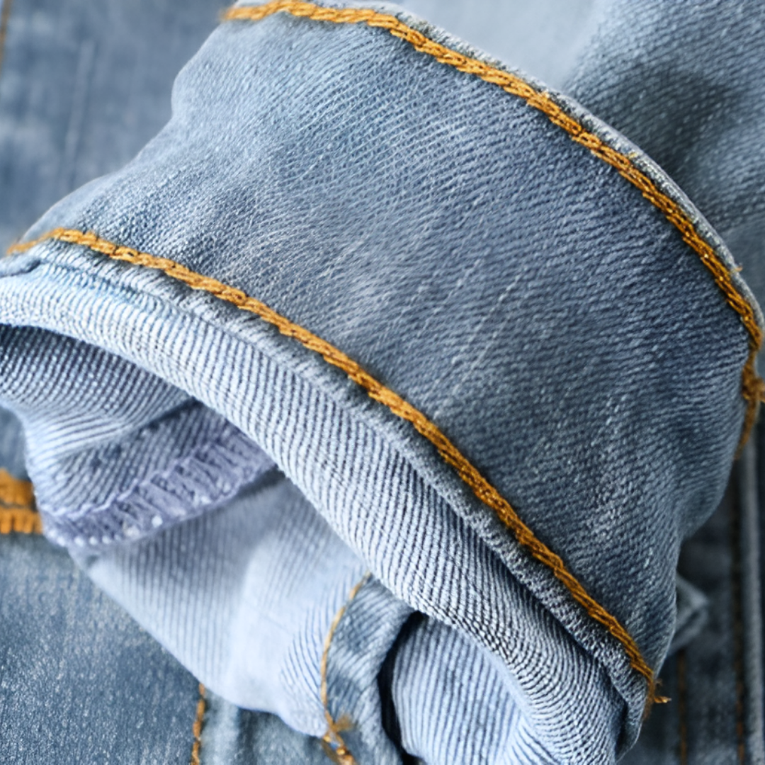 Close-up of denim jacket cuff with contrast stitching
