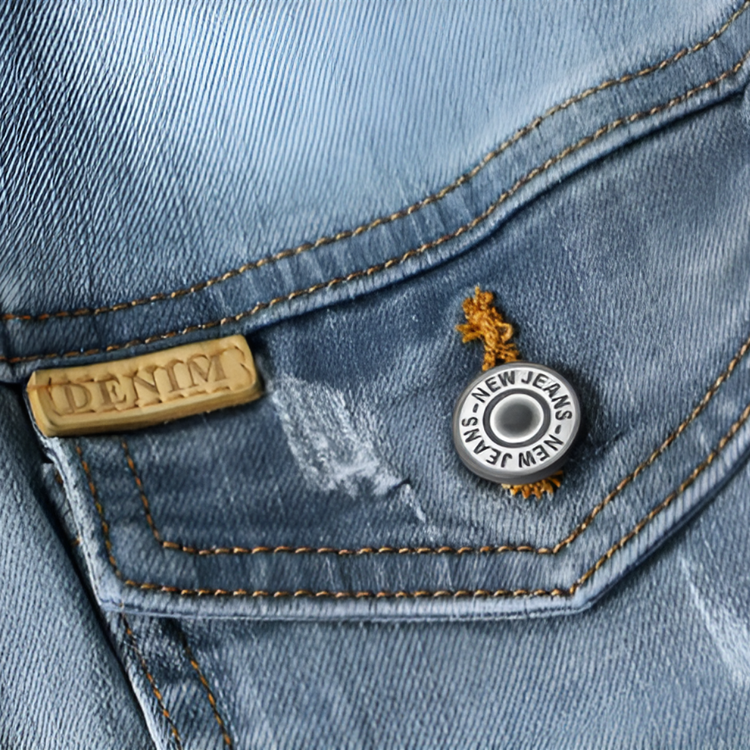 Close-up of snap button with engraved lettering and gold thread accent
