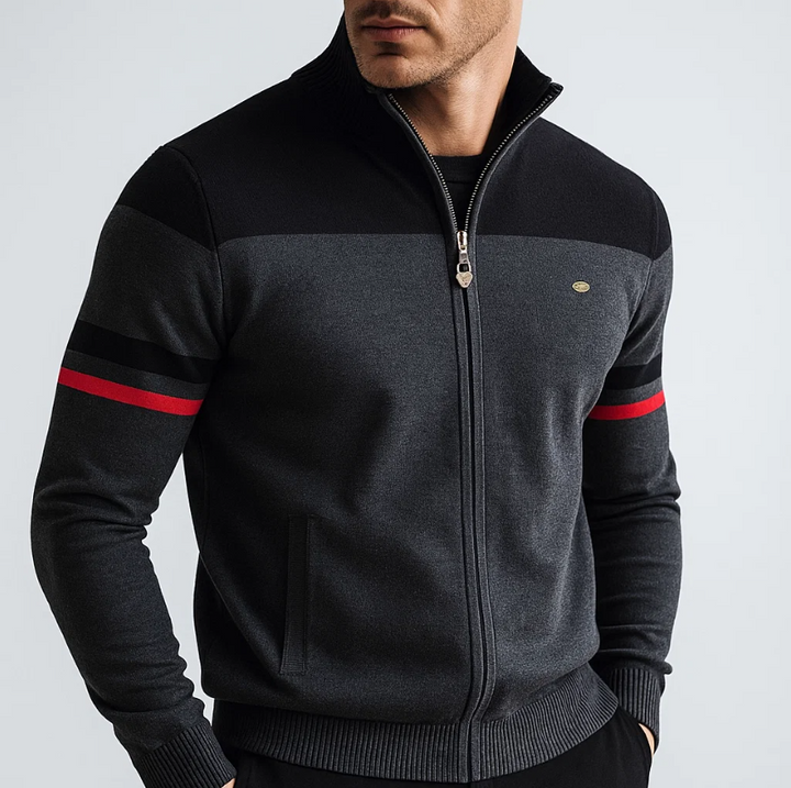 Man wearing Julian colorblock zip cardigan in charcoal and black with red stripe, close-up front view
