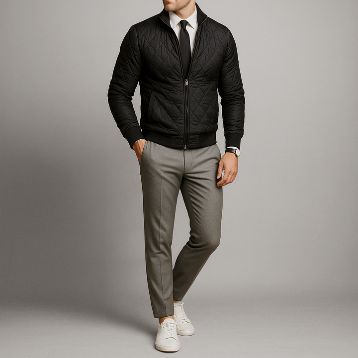 Model wearing Julian quilted bomber jacket styled with dress shirt and trousers