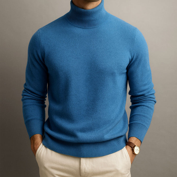 Nathaniel blue turtleneck sweater close-up front view against gray background