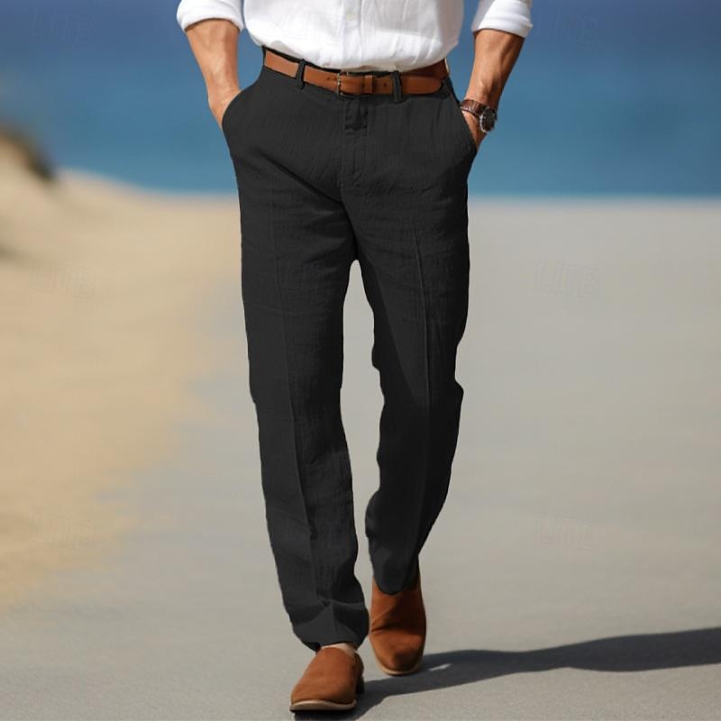 Sebastian belt loop straight leg trousers in black, walking on beach