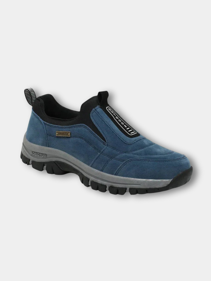 Thaddeus orthopedic slip-on walking sneaker in blue suede, angled front view