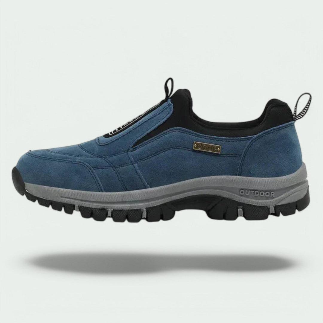 Thaddeus orthopedic slip-on walking sneaker in blue suede, side profile view